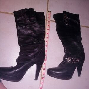 Black leather boots with buckle
